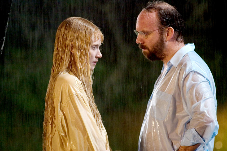 A wet man and woman looking at each other