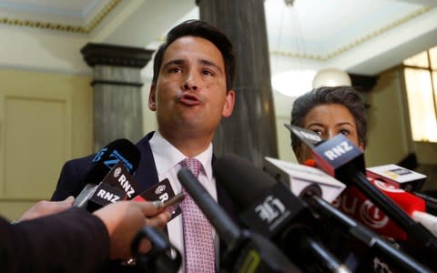 New Zealand's opposition leader Simon Bridges talks to reporters at Parliament in Wellington on Wednesday - Credit:  Nick Perry/ AP