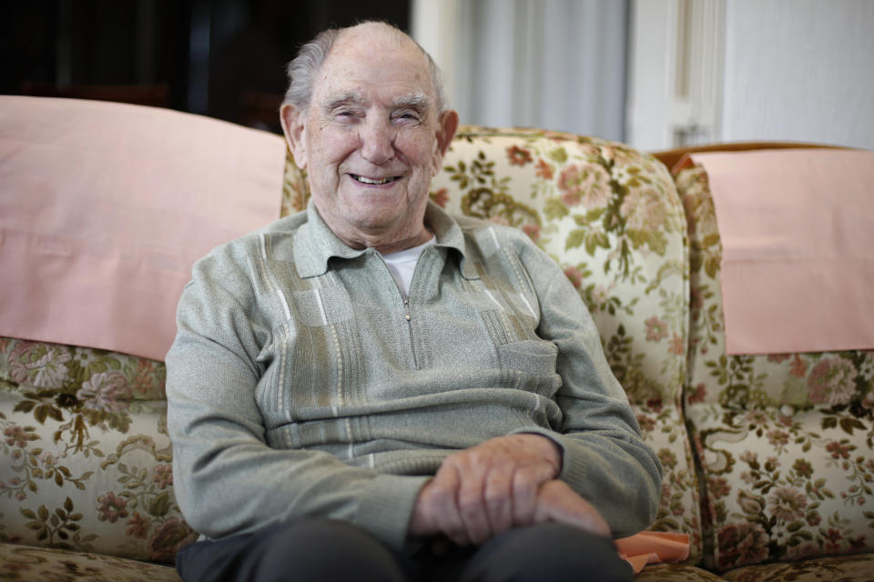 In this photo made May 9, 2019, French World War II veteran Leon Gautier, of the Kieffer commando, poses for a picture in his house, in Ouistreaham, Normandy. Gautier is a D-Day veteran who was part of a 177-man French force that landed on D-Day. (AP Photo/Thibault Camus)