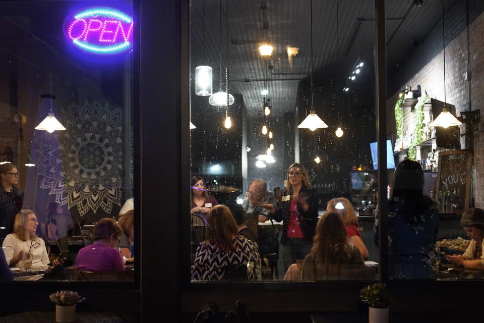 Kelly Dillaha talks during a Red Wine and Blue event in Utica, Mich., Tuesday, Sept. 20, 2022. (AP Photo/Paul Sancya)