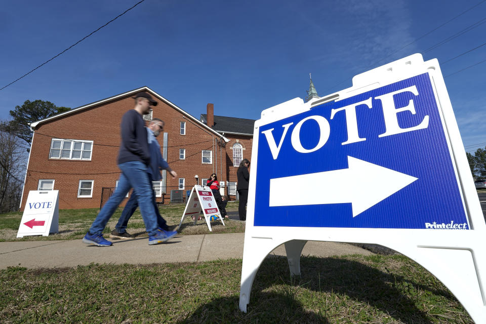 Super Tuesday voters leave a polling location Tuesday, March 5, 2024, in Mount Holly, N.C. (AP Photo/Chris Carlson)