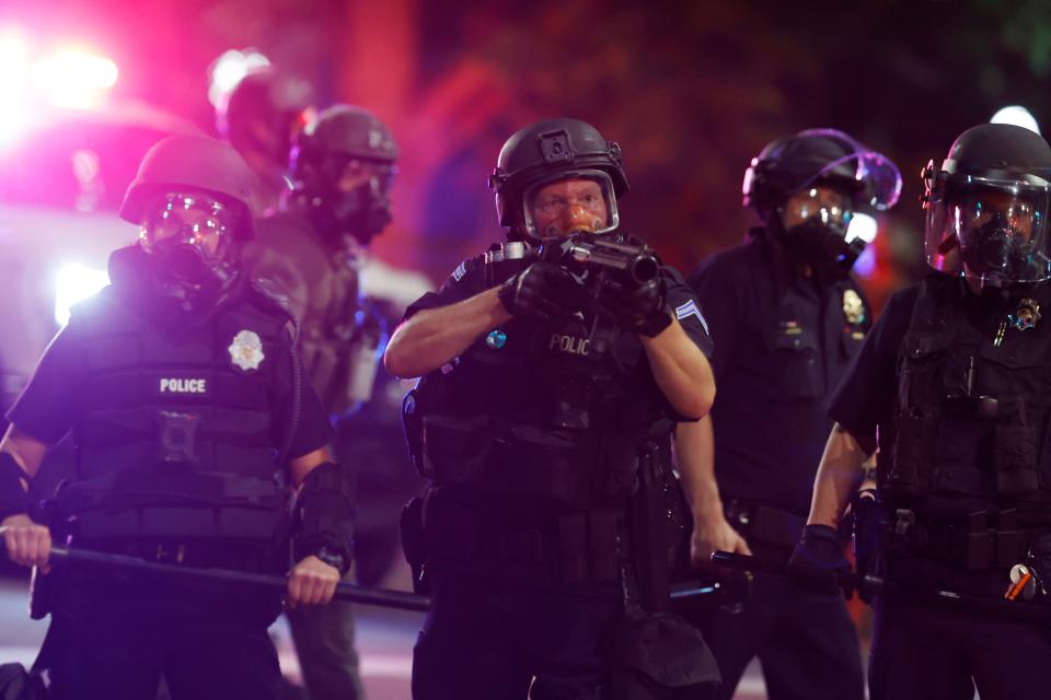 Denver police use tear gas and rubber bullets to disperse a protest May 28 outside the state Capitol over the death of George Floyd, a handcuffed black man in police custody in Minneapolis. Almost 1,000 protesters walked from the Capitol down the 16th Street pedestrian mall during the protest.