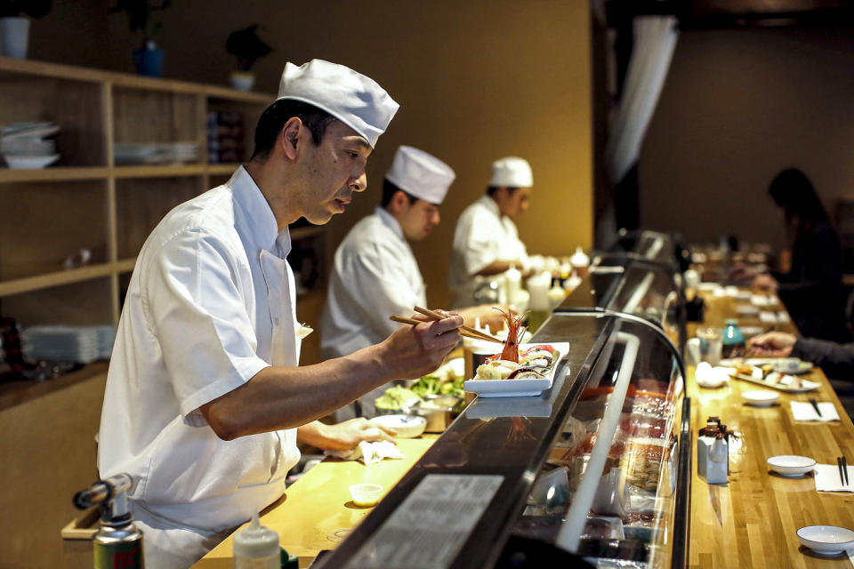 Dine Out: Benkay sushi chef Hiro Ishii puts the final touches on Omakase in Portland, Maine in 2018. (Ben McCanna / Portland Press Herald via Getty Images file)