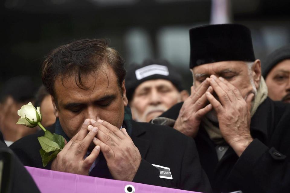 Memorial: Muslim men pray during an event to mark one week since the attack (REUTERS)