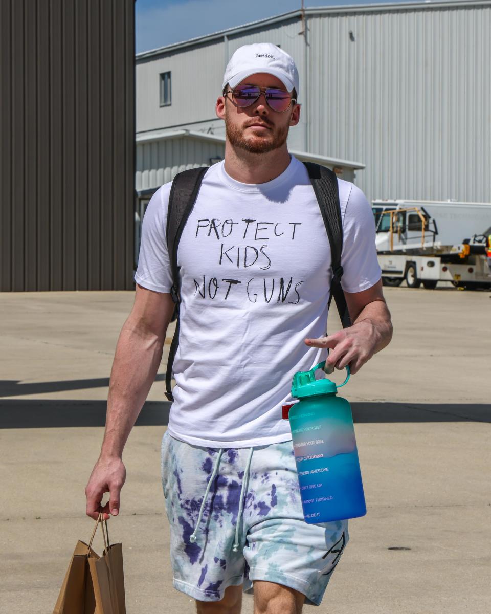 Milwaukee Bucks guard seen wearing a "protect kids not guns" shirt while boarding the team plane headed to Boston for Game 7 of the Eastern Conference semifinals.