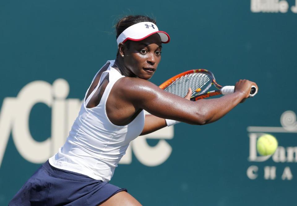 Sloane Stephens returns against Elina Svitolina, of Ukraine, during the Family Circle Cup tennis tournament in Charleston, S.C., Wednesday, April 2, 2014. Svitolina defeated Stephens 6-4, 6-4. (AP Photo/Mic Smith)