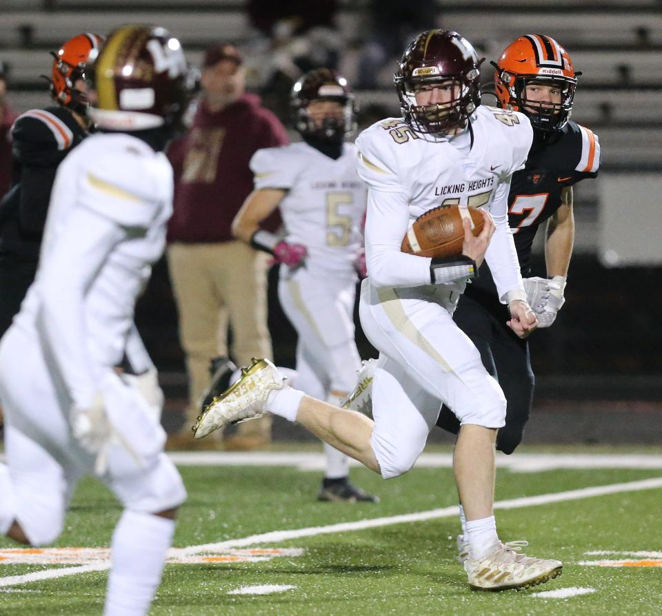 Licking Heights sophomore Jake Lopinto breaks away from the North Canton Hoover for a touchdown in the Hornets' 38-7 loss in a Division II, Region 7 first-round game.