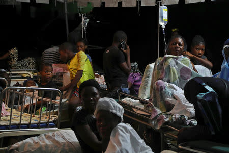 People injured in an earthquake that hit northern Haiti late on Saturday, are being looked after in a tent, in Port-de-Paix, Haiti, October 7, 2018. REUTERS/Ricardo Rojas