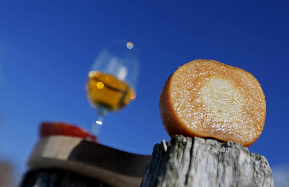 An apple is sliced to show the caramel colour used for the Signature Reserve Speciale Ice Cider at Domaine Pinnacle in Frelighsburg, Quebec