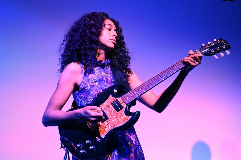 Singer Corinne Bailie-Rae with a guitar on stage