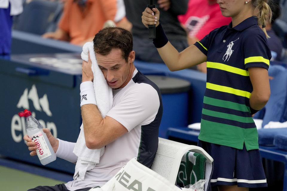 FILE - Andy Murray, of Britain, wipes sweat from his brow during a break in play against Corentin, Moutet, of France, during the first round of the U.S. Open tennis championships, Tuesday, Aug. 29, 2023, in New York. An Associated Press analysis shows the average high temperatures during the U.S. Open and the three other Grand Slam tennis tournaments steadily have grown hotter and more dangerous in recent decades. (AP Photo/Mary Altaffer, File)