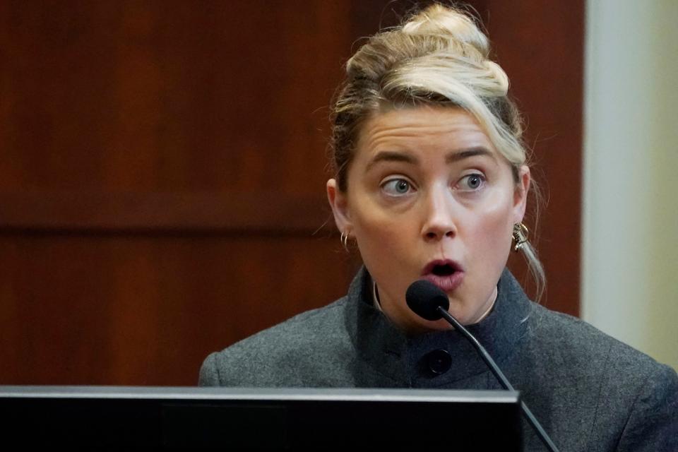 US actress Amber Heard testifies in the courtroom at the Fairfax County Circuit Courthouse in Fairfax, Virginia, on May 16, 2022. - Actor Johnny Depp sued his ex-wife Amber Heard for libel in Fairfax County Circuit Court after she wrote an op-ed piece in The Washington Post in 2018 referring to herself as a 