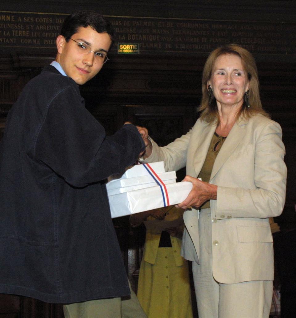 Ernaux presenting an award for achievements in Latin to high school student François Charles in 2001 (AFP via Getty Images)