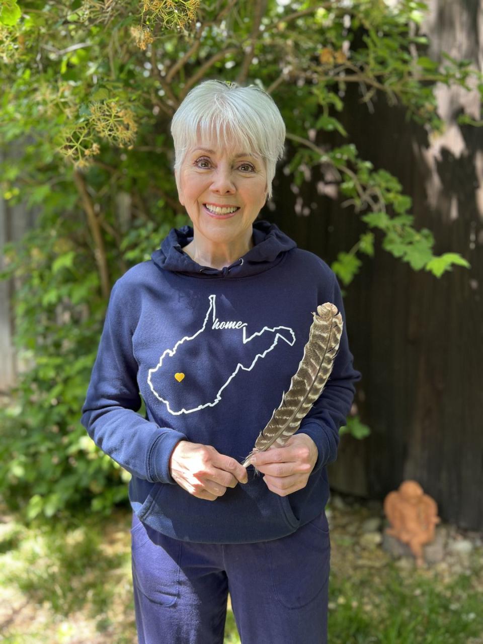 actress joyce dewitt, 74, wearing navy sweatshirt with state of west virginia on it that says home