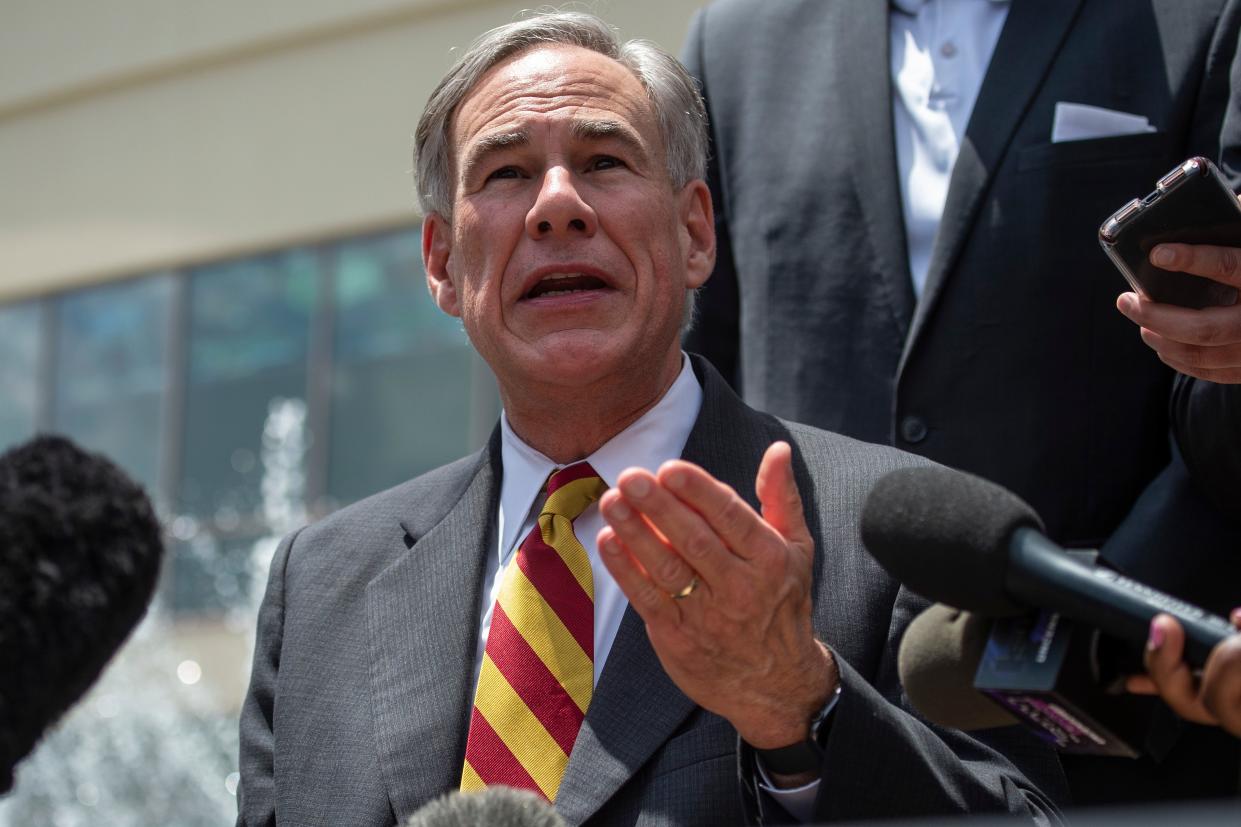 Republican Gregg Abbott claimed people could still choose to wear masks (AFP via Getty Images)