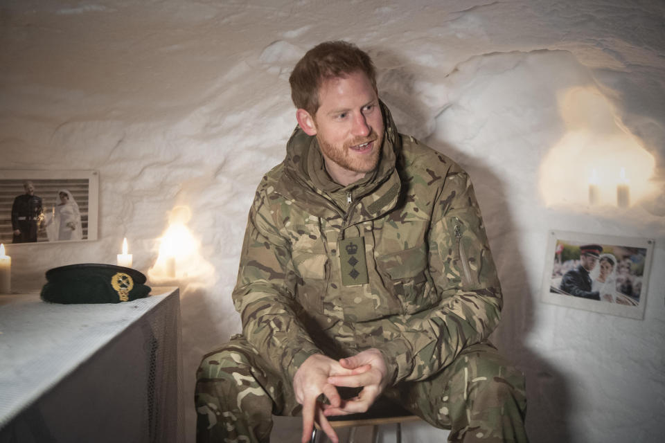 Prince Harry, Duke of Sussex, sits in a Quincey Shelter, a makeshift shelter built of snow, which doubled as a personal shrine to the royal and the Duchess of Sussex.&nbsp; (Photo: WPA Pool via Getty Images)