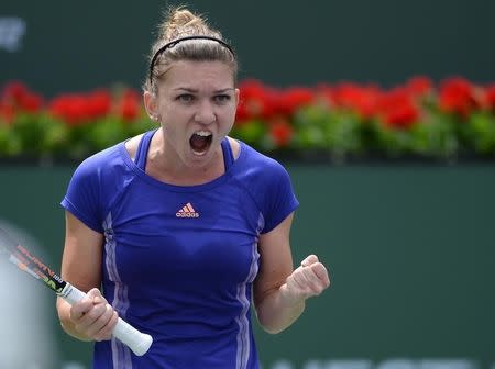 Mar 22, 2015; Indian Wells, CA, USA; Simona Halep (ROM) reacts during her match against Jelena Jankovic (SRB) in the finals of the BNP Paribas Open at the Indian Wells Tennis Garden. Halep won 2-6, 7-5, 6-4. Mandatory Credit: Jayne Kamin-Oncea-USA TODAY