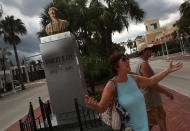 <p>Jacki Lewan and Steve Lewan (L-R), from Pittsburgh, Pennsylvania, walk away after looking at a bronze bust of Confederate general Robert E. Lee on display in the median on Monroe street in the midst of a national controversy over whether Confederate symbols should be removed from public display on August 18, 2017 in Fort Myers, Fla. (Photo: Joe Raedle/Getty Images) </p>