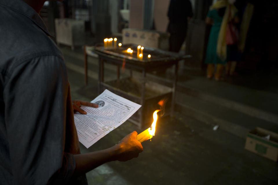 In this Saturday, Nov. 3, 2018, photo, a devotee prays at St. Mary's Church in Kottayam in the southern Indian state of Kerala. For decades, nuns in India have quietly endured sexual pressure from Catholic priests, an AP investigation has revealed. (AP Photo/Manish Swarup)