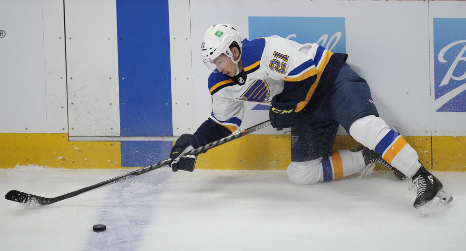 St. Louis Blues center Tyler Bozak loses his footing while trying to collect the puck in the first period of an NHL hockey game against the Colorado Avalanche Tuesday, April 26, 2022, in Denver. (AP Photo/David Zalubowski)