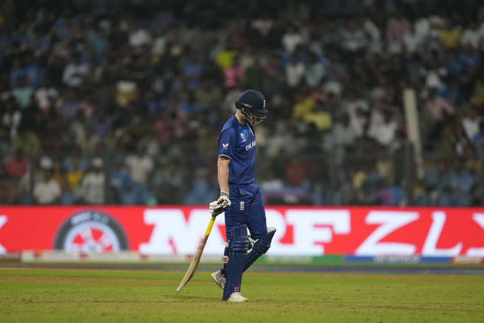 England's Harry Brook walks off the field after losing his wicket during the ICC Men's Cricket World Cup match between South Africa and England in Mumbai, India, Saturday, Oct. 21, 2023. (AP Photo/ Rafiq Maqbool)