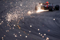 <p>SHANGHAI, CHINA – APRIL 14: Sparks fly behind Max Verstappen of the Netherlands driving the (33) Aston Martin Red Bull Racing RB14 TAG Heuer during qualifying for the Formula One Grand Prix of China at Shanghai International Circuit on April 14, 2018 in Shanghai, China. (Photo by Lars Baron/Getty Images) </p>