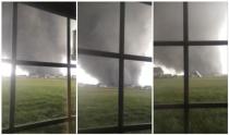 An active tornado is seen through a window as it touches down in Washington, Illinois on November 17, 2013, in this combination of three still images captured from a video courtesy of Anthony Khoury. REUTERS/Anthony Khoury/Handout via Reuters