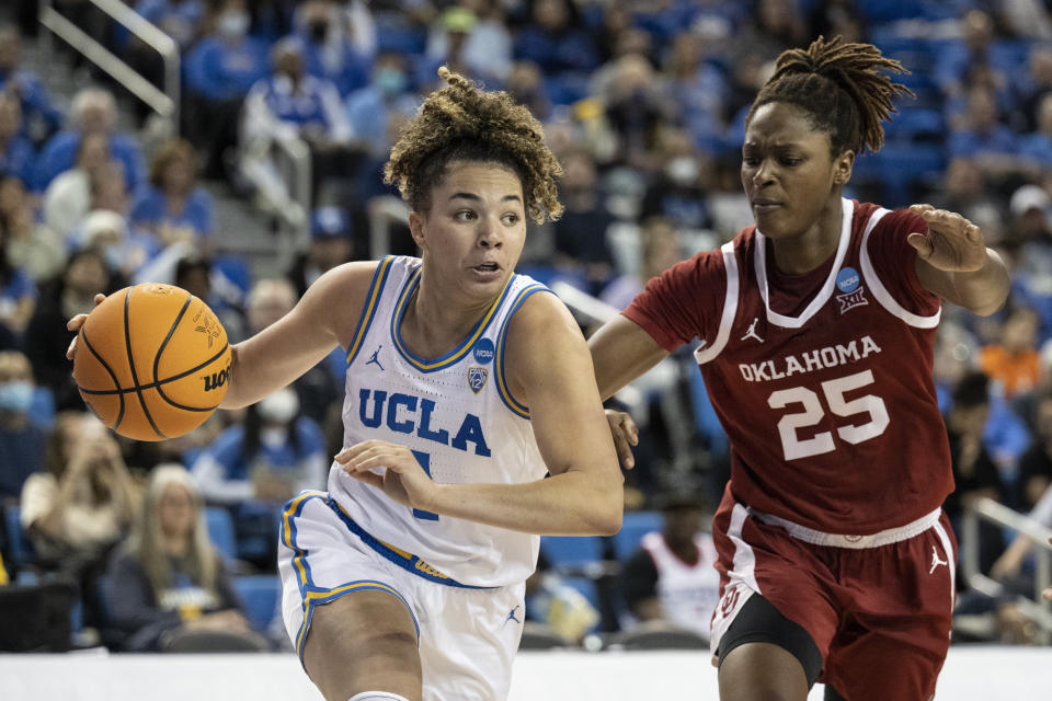 UCLA guard Kiki Rice, left, drives towards the basket as Oklahoma forward Madi Williams defends during the second half of a second-round college basketball game in the NCAA Tournament, Monday, March 20, 2023, in Los Angeles, Calif. (AP Photo/Kyusung Gong)