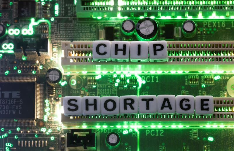FILE PHOTO: Illustration shows plastic letters arranged to read "Chip Shortage" placed on a computer motherboard