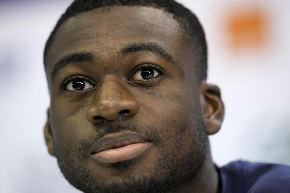 France's Youssouf Fofana answers questions during a press conference at the Jassim Bin Hamad stadium in Doha, Qatar, Thursday, Dec. 8, 2022. France will play against England during their World Cup quarter-final soccer match on Dec. 10. (AP Photo/Christophe Ena)