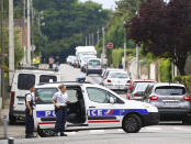 <p>French police officers prevent the access to the scene of an attack in Saint Etienne du Rouvray, Normandy, France, Tuesday, July 26, 2016. (AP Photo/Francois Mori)</p>