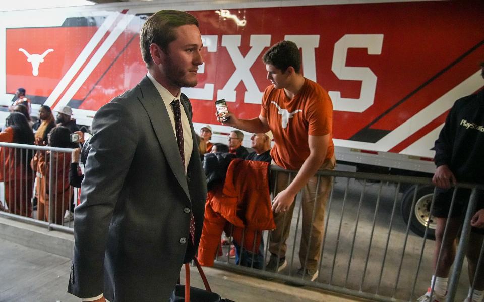 Quinn Ewers makes his way into Amon G. Carter Stadium ahead of Texas' win over TCU in November. Ewers enters his third season this fall as the Longhorns' starter and is generating some preseason Heisman Trophy buzz.