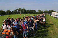 <p>Festival fans queue as the gates open at the Glastonbury Festival amid heightened security at Worthy Farm in Pilton on June 21, 2017 near Glastonbury, England. (Photo: Matt Cardy/Getty Images) </p>