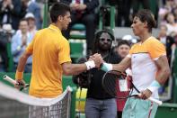 Serbia's Novak Djokovic and Spain's Rafael Nadal (R), seen here at the Monte-Carlo Masters, could face each other in the quarter-final of the French Open