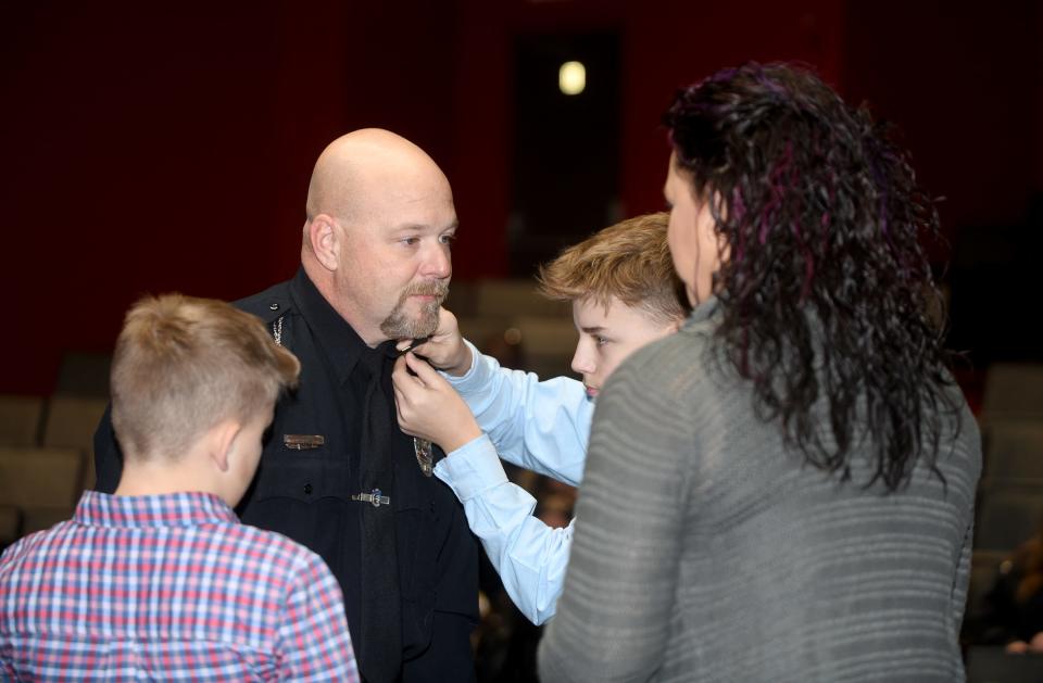 Michael D. Jones, a detective with Alliance Police Department, was promoted to sergeant Wednesday, Nov. 29, 2023, during a ceremony at Firehouse Theatre as his family looked on.