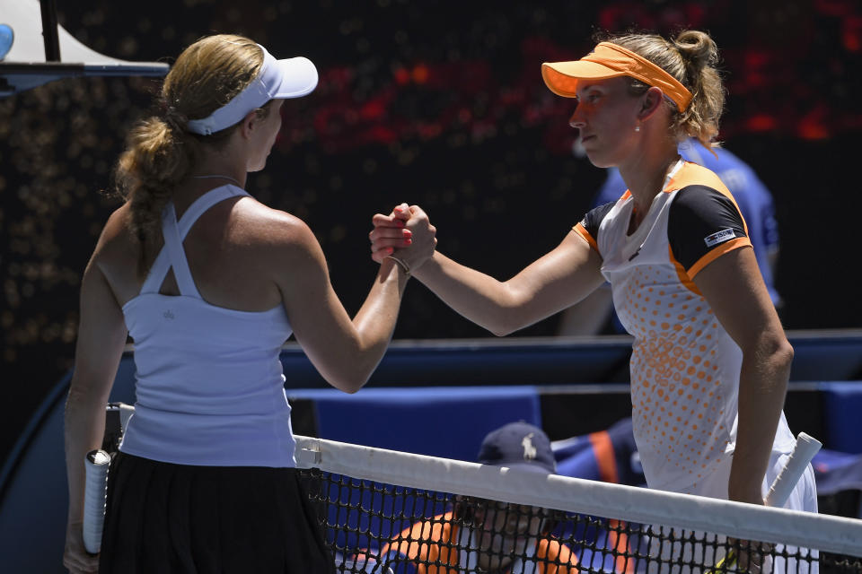 Danielle Collins, left, of the U.S. is congratulated by Elise Mertens of Belgium following their fourth round match at the Australian Open tennis championships in Melbourne, Australia, Monday, Jan. 24, 2022.(AP Photo/Andy Brownbill)