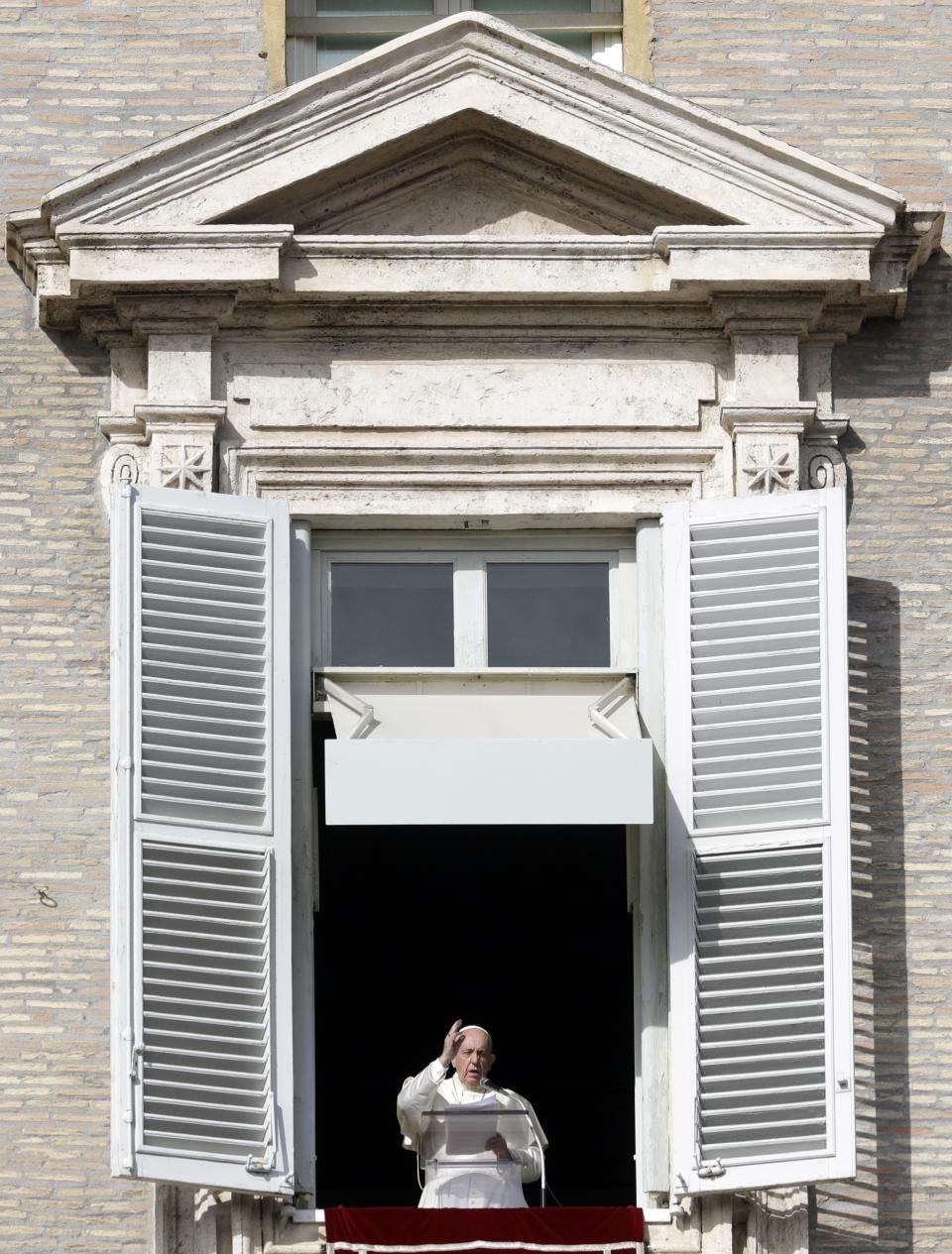 Pope Francis delivers his blessing during his Angelus prayer from his studio window overlooking St. Peter's Square, at the Vatican, Sunday, Nov. 10, 2019. (AP Photo/Gregorio Borgia)