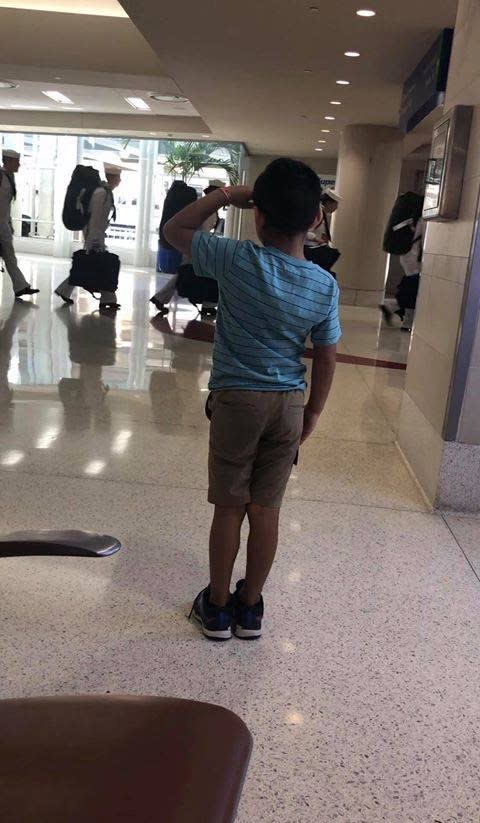 Six-year-old Jace Vega saluted members of the U.S. Navy at a Texas airport. (Photo: Courtesy of Joe Vega)