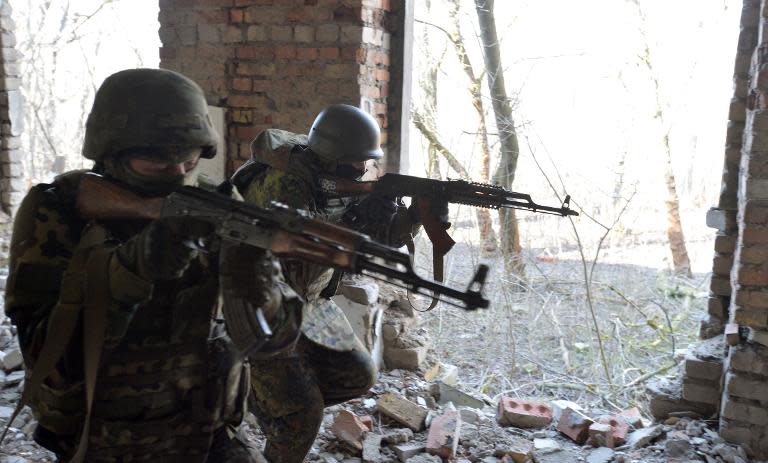 Ukrainian fighters with the Azov volunteer battalion take part in military exercises near the southeastern city of Mariupol, on February 27, 2015