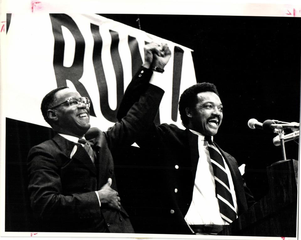 An enthusiastic crowd of about 2,000 turned out to hear Jesse Jackson in Flint Thursday after he declared his candidacy iin Washington. Joining him was James Sharp