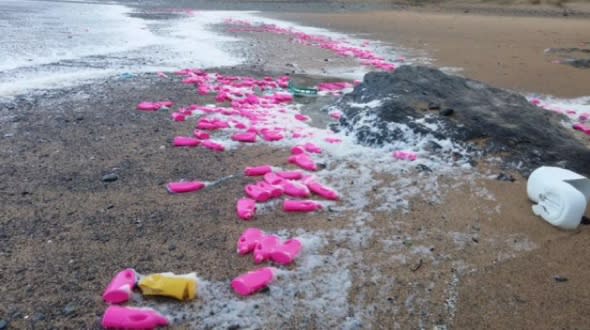 Thousands of pink bottles wash up on beach in Cornwall