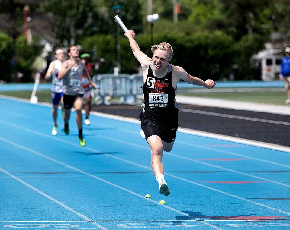 Winnebago's Michael Cunningham celebrates as he crosses the finish line first in the 4x200-meter relay at the Illinois High School Association boys track and field state finals Saturday, May 28, 2022, in Charleston.