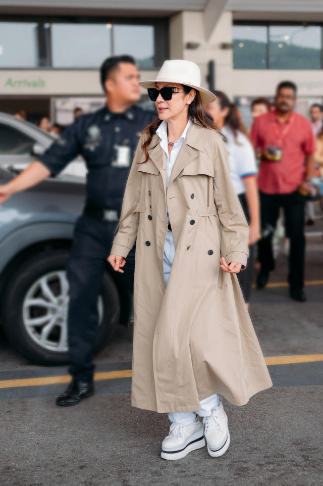 Michelle Yeoh slays her airport look in a chic Dior trench coat