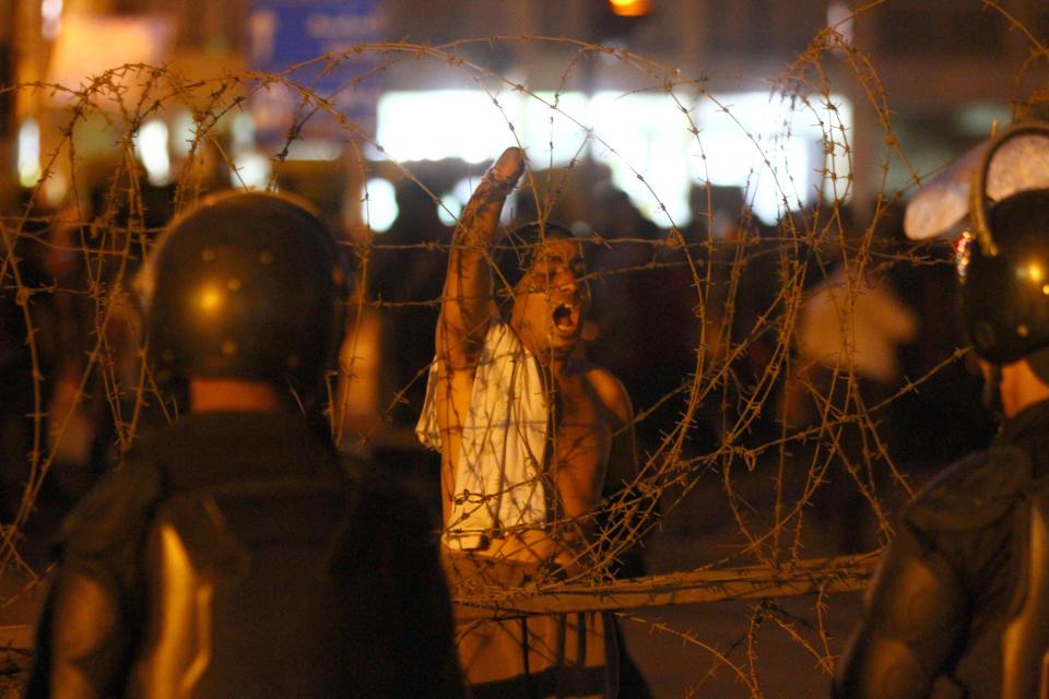 Demonstrators protest in front of the presidential palace in Cairo, Egypt, Saturday, April 26, 2014. Hundreds of secular-minded activists and protesters rallied in front of the presidential palace Saturday, demanding the interim president abolish a disputed protest law used extensively over the past months to jail and prosecute activists, including leading figures of the 2011 uprising that toppled longtime autocrat Hosni Mubarak.