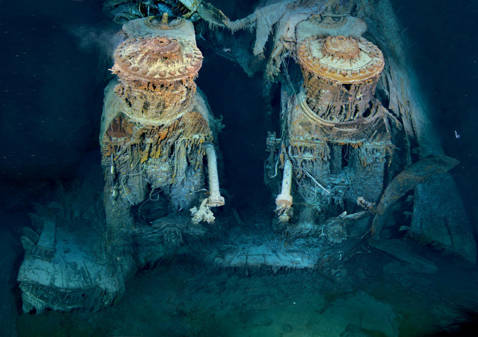 Two of Titanic’s engines lie exposed in a gaping cross section of the stern. Draped in “rusticles”—orange stalactites created by iron-eating bacteria—these massive structures, four stories tall, once powered the largest moving man-made object on Earth. COPYRIGHT© 2012 RMS TITANIC, INC; Produced by AVIL, Woods Hole Oceanographic Institute. <br><a href="http://ngm.nationalgeographic.com/2012/04/titanic/sides-text" rel="nofollow noopener" target="_blank" data-ylk="slk:See more photos at National Geographic.com;elm:context_link;itc:0;sec:content-canvas" class="link ">See more photos at National Geographic.com</a>