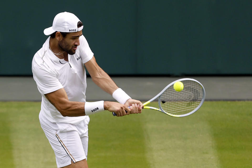 Italy's Matteo Berrettini returns the ball to Spain's Rafael Nadal during their practice on Center Court ahead of the 2022 Wimbledon Championship at the All England Lawn Tennis and Croquet Club, in London, Thursday, June 23, 2022. (Steven Paston/PA via AP)