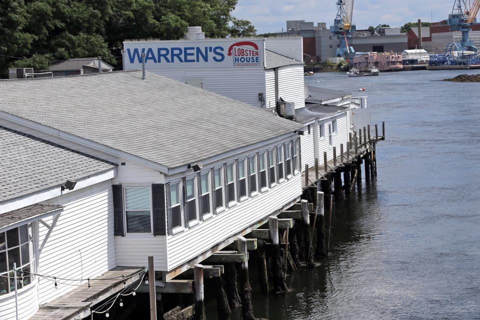 The Portsmouth Naval Shipyard is seen across the river from the well loved Warren's Loster House in Kittery Aug. 11, 2023. The Cunningham family is considering selling Warren’s and the entire property after being approached by the potential buyer in the spring.
