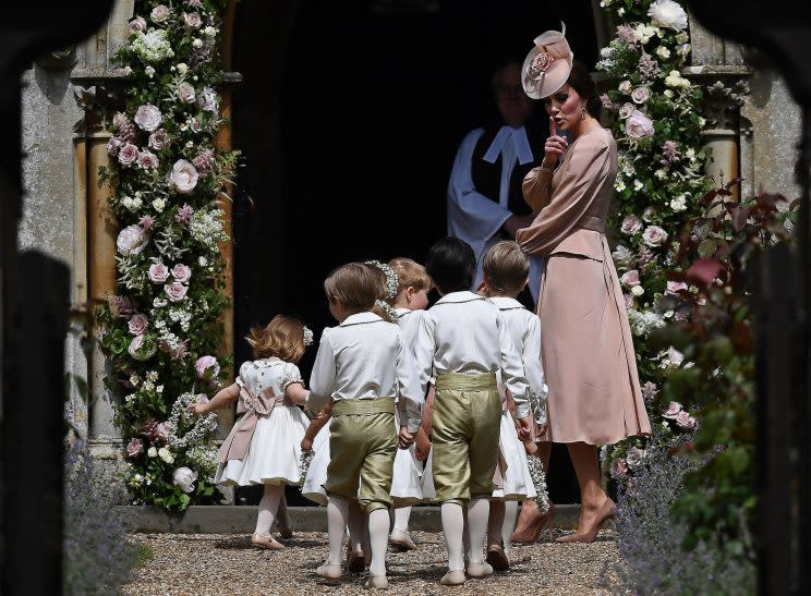 The Duchess of Cambridge gentle shushes the children's bridal party at her sister Pippa Middleton's wedding [Photo: PA]