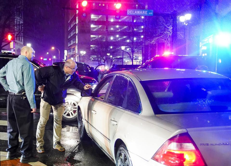 Members of the United States Secret Service speak to the driver of the vehicle that crashed into a Secret Service SUV that was blocking the street as U.S. President Joe Biden exited his campaign headquarters, in Wilmington, North Carolina, U.S. December 17, 2023 (REUTERS)