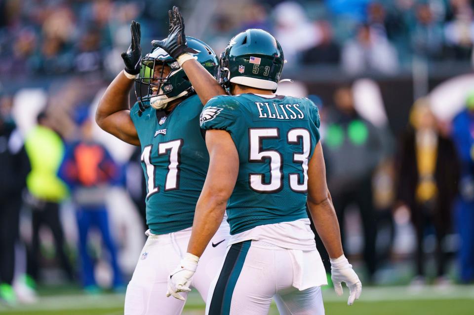 Philadelphia Eagles linebacker Nakobe Dean (17) reacts with linebacker Christian Elliss (53) during a game against the Tennessee Titans on Sunday, Dec. 4, 2022 in Philadelphia.